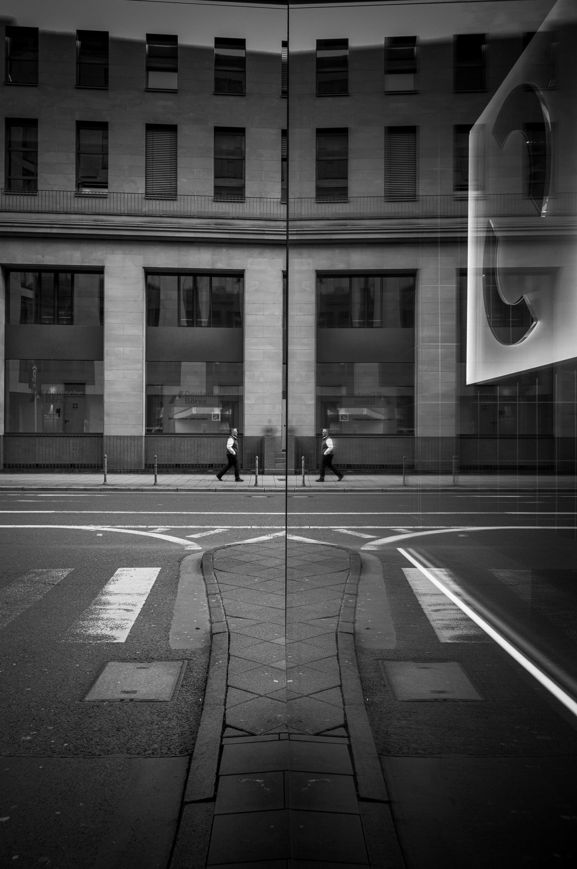 Quiet street crossing in reflection - across.