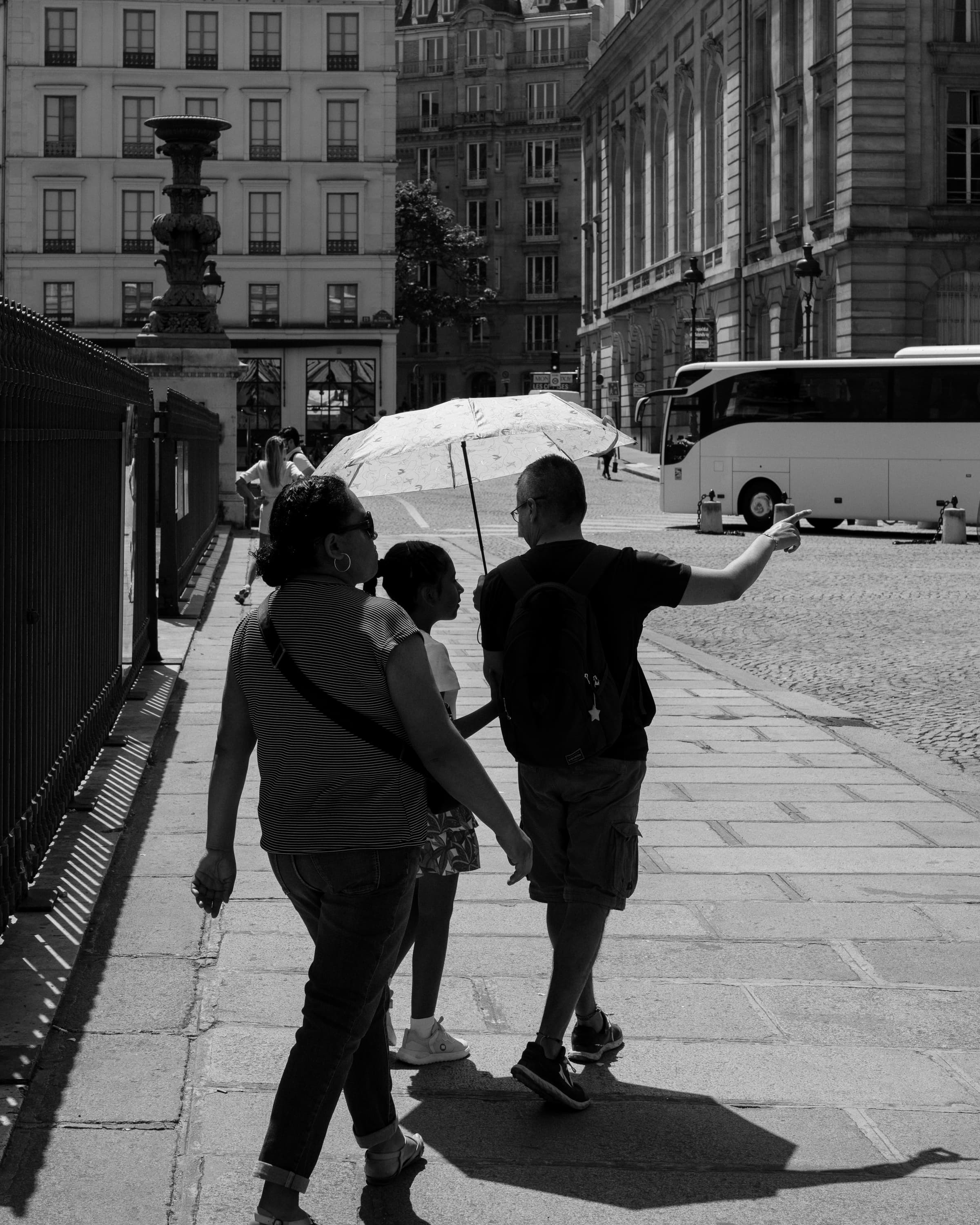 Pointing gesture on a Paris square - onward.
